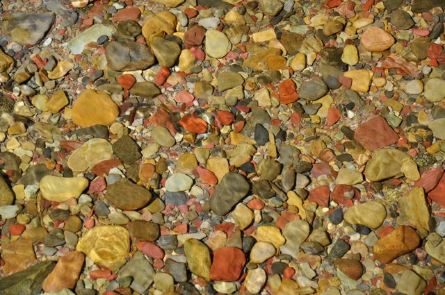 Stones in stream along Grinnell Lake Trail